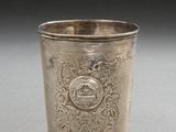 a silver cup that is sitting on a table