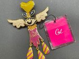 a close up of a pin with a tag on it