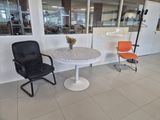 two chairs and a table in a room
