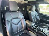 the interior of a car with black leather seats and a center console