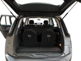 a trunk of a car with luggage in the back