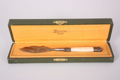 a small knife in a box on a table