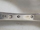 a spoon that has some writing on it