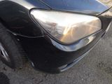 a close up of a car ' s headlight and front bumper