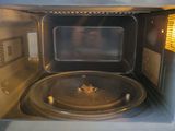 a close up of a microwave with the door open