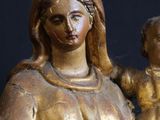 a statue of a woman holding a baby in her arms