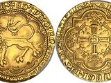 a gold coin with an image of a lion on it