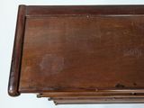 a small wooden table with a drawer underneath it