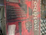 a box of tools sitting on top of a metal table
