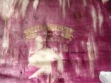 a close up of a pink cloth with a picture of a woman on it