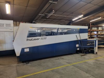 a close up of a machine that is in a warehouse