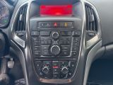 the dashboard of a car with a red light on it