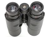 two binoculars that are sitting next to each other on a table