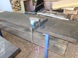 a picture of a workbench with a clamp on top of it