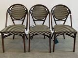 three chairs with black and white checkered seat covers on them