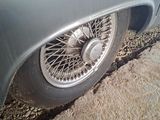 a close up of a car tire on the side of the road