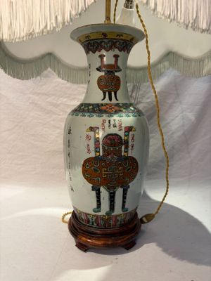 a lamp that is sitting on a table next to a lamp shade