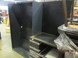 a man that is standing in front of a cabinet