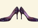 purple high heeled shoes on a white background