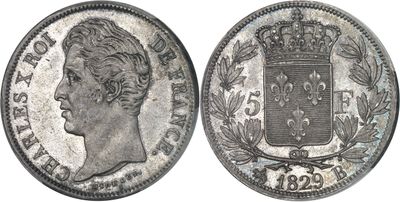 a silver coin with a crown on the front and a crown on the back