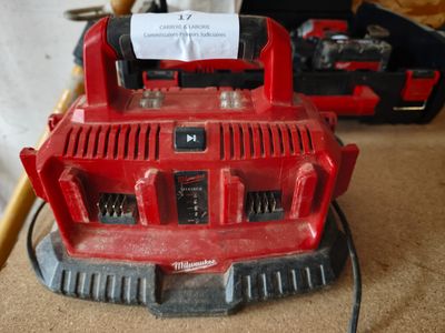 a red machine that is sitting on the floor