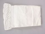 a white piece of paper with a lace on it