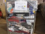 a metal cart with many items in it in a warehouse
