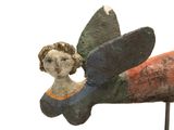 a statue of a woman sitting on top of a plane