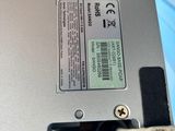 a close up of a laptop computer with wires coming out of it
