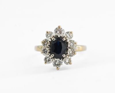 a close up of a black and white diamond ring on a white background