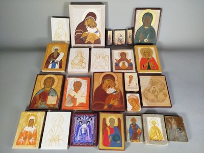 a lot of different religious icons displayed on a table