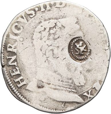 a close up of a coin on a white surface