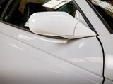 a close up of a car ' s side mirror on the side of the car