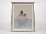 an image of a picture of two mountains in a frame on a table
