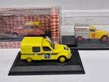 a yellow truck and a yellow car in a display case