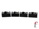 four black cameras are lined up in a row on a white surface