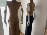 three mannequins that are standing in a room