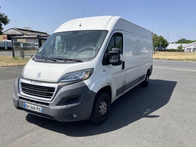 the white van is parked on the side of the road