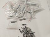 a pile of screws and screws on a table