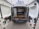 a white van with the door open on the side of the road