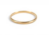a close up of a gold ring on a white background
