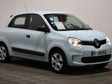 a picture of a small blue car parked in a room
