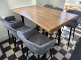 a picture of a kitchen table and chairs in a room