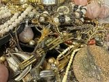 a pile of jewelry that is sitting on a table
