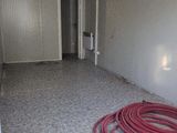 a room with a red hose in it and a white door