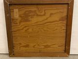 an old wooden picture frame with a small hole in the middle