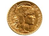gros plan d'une pièce d'or avec un visage de femme