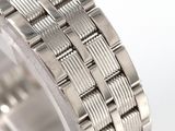 a close up view of a stainless steel bracelet on a white surface