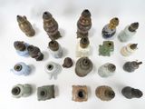 a lot of old and rusty objects on a white surface