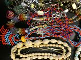 a lot of beads and necklaces on a table